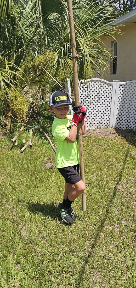 Jake's son helping on an Extreme Junk Removal yard job
